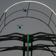 Two small FPV drones flying through a gate at Dubai’s World Drone Prix in March.